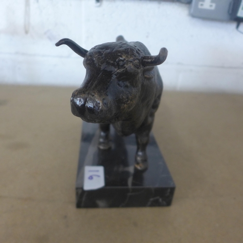 5070 - A cast metal bull figure on a stone base  *This lot is subject to VAT