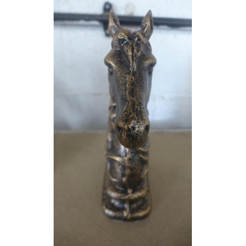 5077 - A pair of cast metal horse head bookends  *This lot is subject to VAT