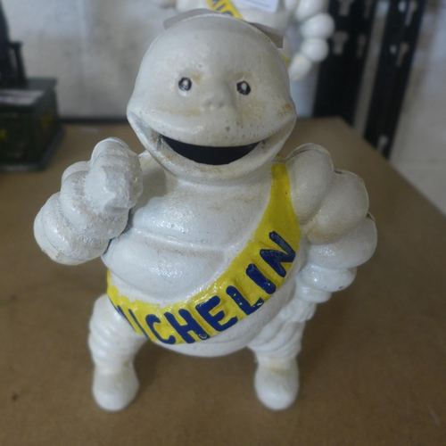 5081 - 2 cast metal Michelin Man money banks  *This lot is subject to VAT