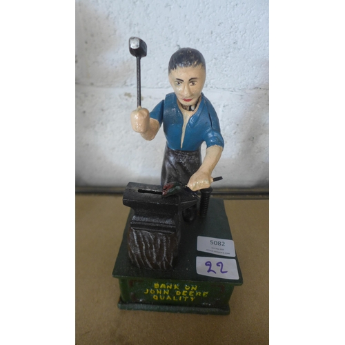 5082 - A cast metal John Deere money bank  *This lot is subject to VAT