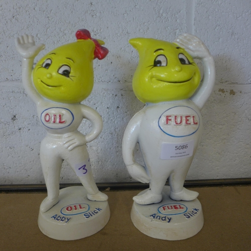 5086 - A cast metal Abby Slick oil figure and a cast metal Andy Slick fuel figure   *This lot is subject to... 