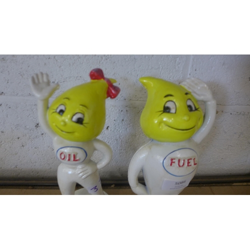 5086 - A cast metal Abby Slick oil figure and a cast metal Andy Slick fuel figure   *This lot is subject to... 