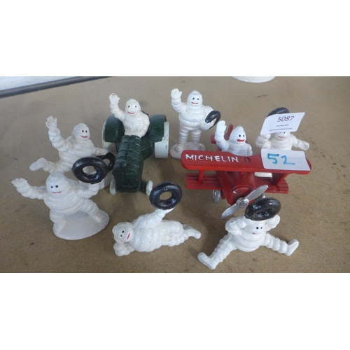 5087 - A quantity of cast metal Michelin figures including a plane, tractor and men  *This lot is subject t... 
