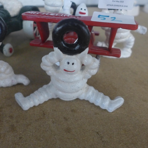 5087 - A quantity of cast metal Michelin figures including a plane, tractor and men  *This lot is subject t... 