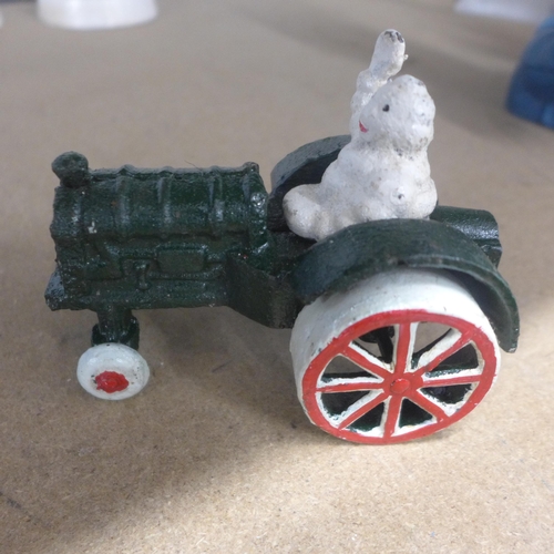 5087 - A quantity of cast metal Michelin figures including a plane, tractor and men  *This lot is subject t... 