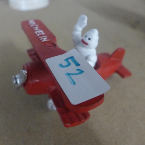 5087 - A quantity of cast metal Michelin figures including a plane, tractor and men  *This lot is subject t... 