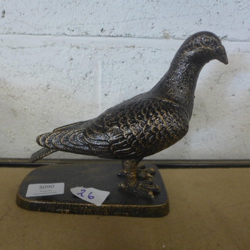 5090 - A cast metal pigeon ornament on base  *This lot is subject to VAT