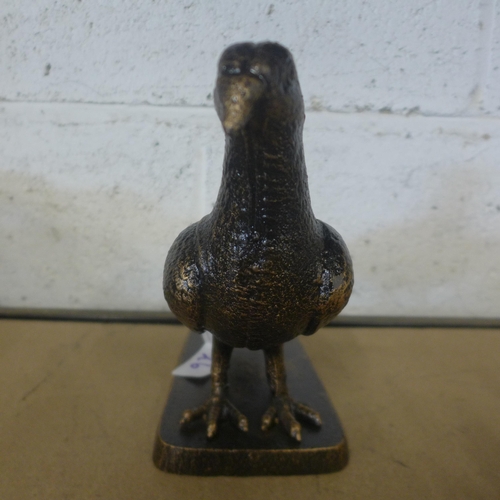 5090 - A cast metal pigeon ornament on base  *This lot is subject to VAT