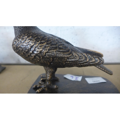 5090 - A cast metal pigeon ornament on base  *This lot is subject to VAT