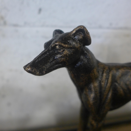 5091 - A cast metal Retriever figure and a cast metal greyhound figure *This lot is subject to VAT