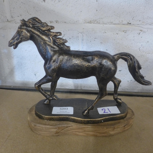5093 - A cast metal running horse figure  *This lot is subject to VAT