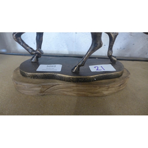 5093 - A cast metal running horse figure  *This lot is subject to VAT