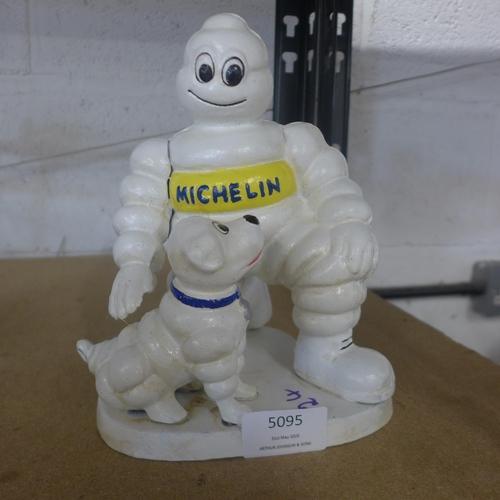 5095 - A cast metal Micheline figure with dog  *This lot is subject to VAT
