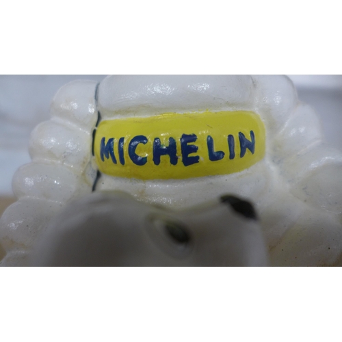 5095 - A cast metal Micheline figure with dog  *This lot is subject to VAT