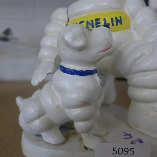 5095 - A cast metal Micheline figure with dog  *This lot is subject to VAT