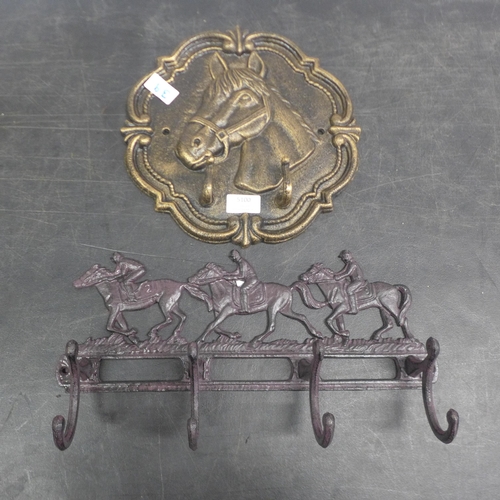 5100 - 2 cast metal coat racks  *This lot is subject to VAT