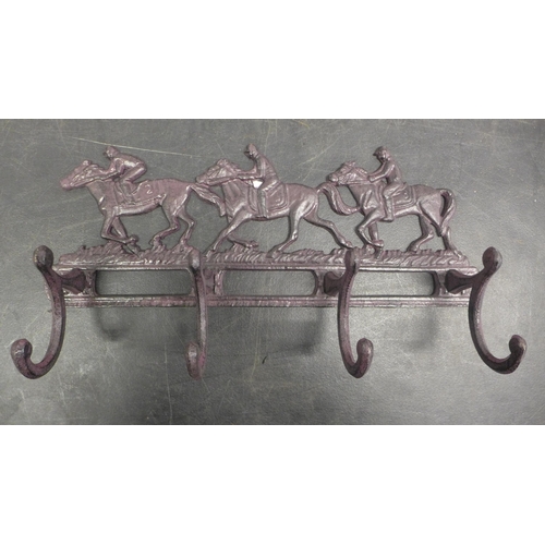 5100 - 2 cast metal coat racks  *This lot is subject to VAT