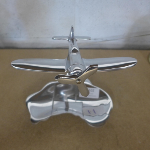 5102 - A polished aluminium plane and map trinket tray  *This lot is subject to VAT