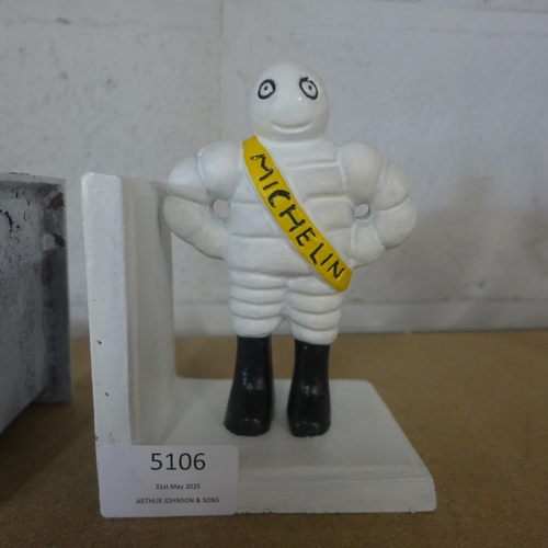 5106 - A pair of cast metal Michelin bookends  *This lot is subject to VAT