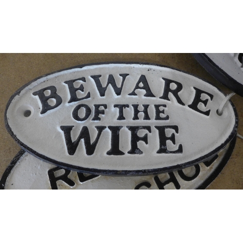 5110 - 4 oval cast metal signs including “friends always welcome family by appointment”, “no entry”, “bewar... 