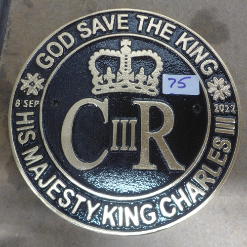 5121 - A cast metal Elizabeth II wall plaque and a cast metal Charles III wall plaque *This lot is subject ... 