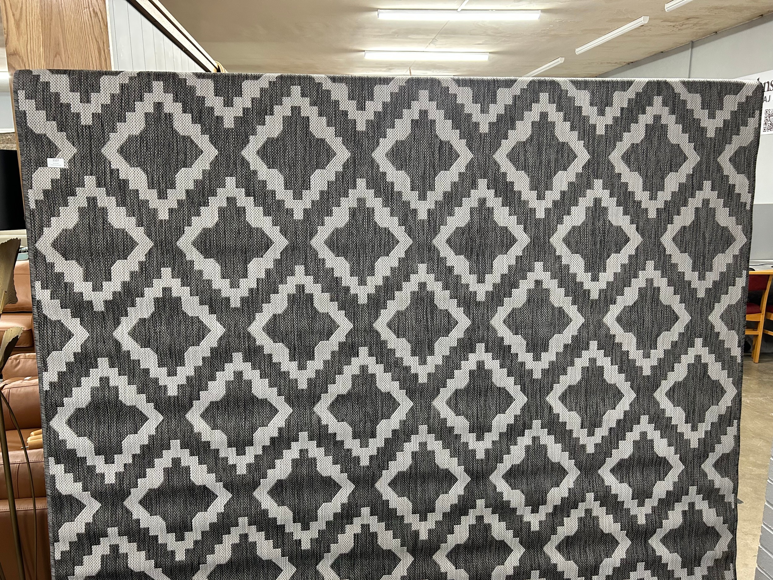 A large modern grey pattern rug