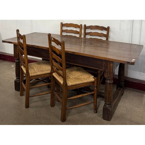 154 - An 18th Century style oak refectory table and four chairs