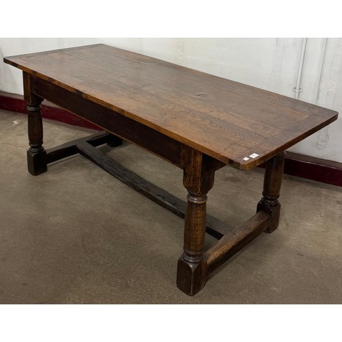 154 - An 18th Century style oak refectory table and four chairs