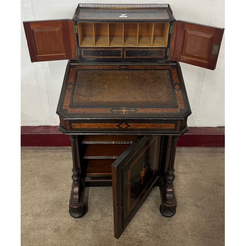 131 - A Victorian ebonised and amboyna Davenport