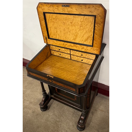 131 - A Victorian ebonised and amboyna Davenport