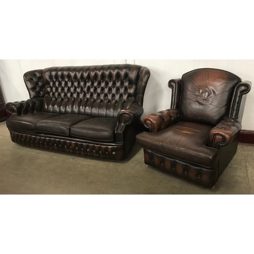 144B - A chestnut brown leather Chesterfield wingback settee and armchair