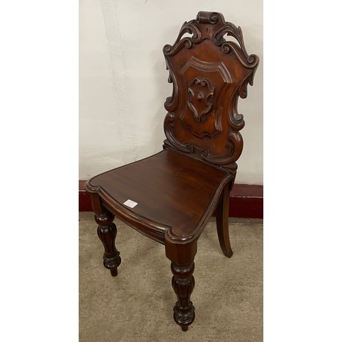 128A - A Victorian carved mahogany hall chair