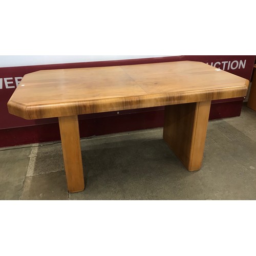144A - An Art Deco walnut dining table