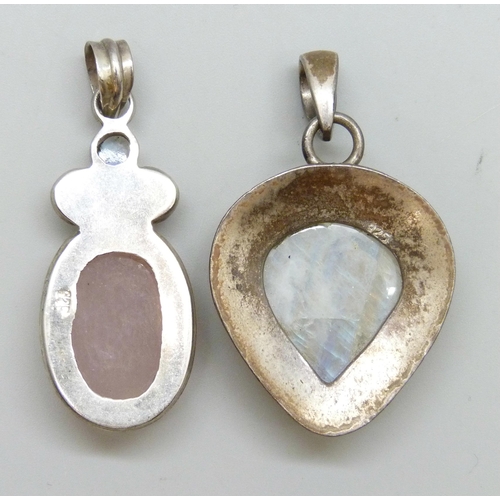 7085 - Two large silver pendants, both set with moonstone, and one with rose quartz, 29g, largest 5.3cm