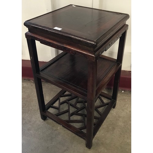 162 - A Chinese carved softwood three tier etagere