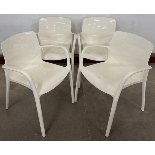 180 - A set of four white Perspex stacking chairs