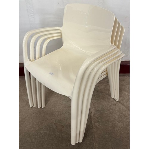 180 - A set of four white Perspex stacking chairs