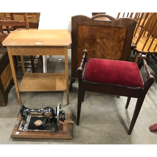 173 - An oak occasional table, firescreen, beech piano stool and a Jones sewing machine