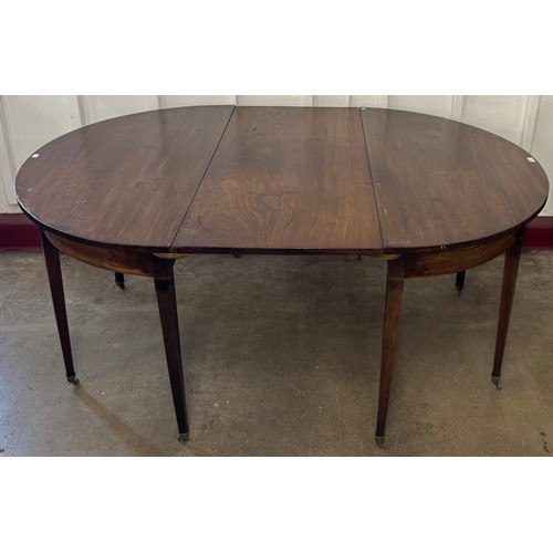 188 - A George III mahogany oval extending dining table