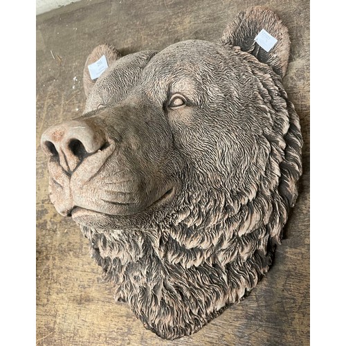 272 - A concrete garden bear face mask