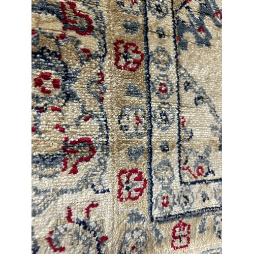 170D - An Eastern ivory ground rug
