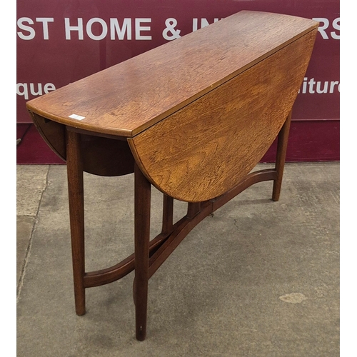 6 - A teak drop-leaf table