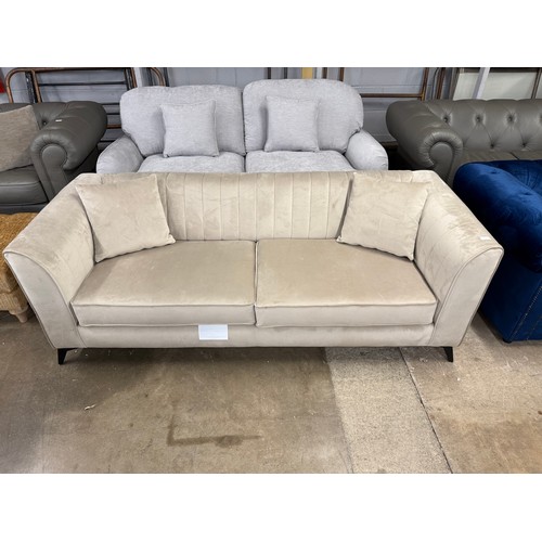 3157 - A champagne velvet upholstered shell back 3 seater sofa (transit mark)