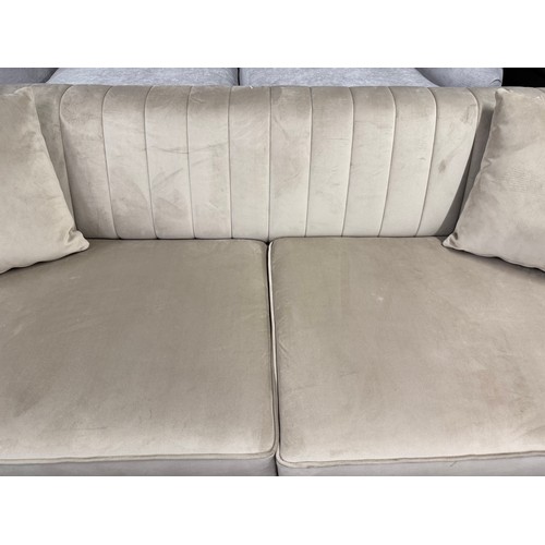 3157 - A champagne velvet upholstered shell back 3 seater sofa (transit mark)