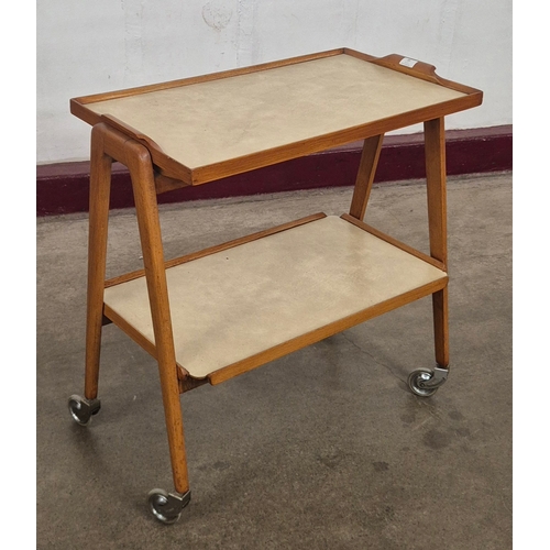 20 - A teak and Formica two tier cocktail trolley