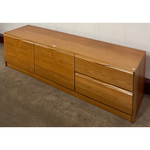 26 - A teak lowboard