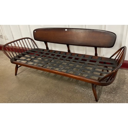 29 - An Ercol Golden Dawn elm and beech studio couch