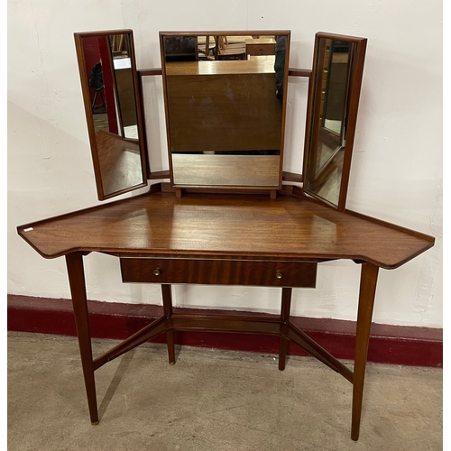 48 - A Greaves & Thomas afromosia corner dressing table