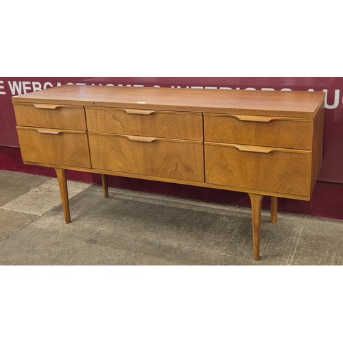49 - An Austin Suite teak six drawer sideboard