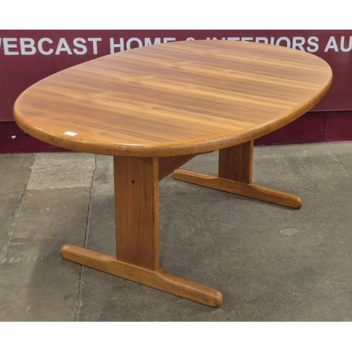44 - A Danish teak oval extending dining table